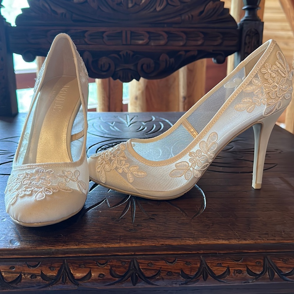 David’s Bridal, ivory lace high heeled shoes in excellent condition.
